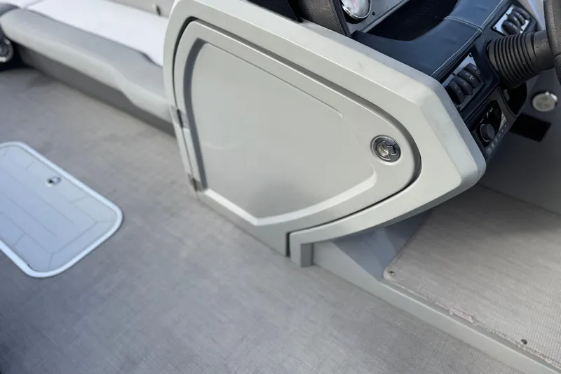 Slide: The Image of 2020 Godfrey Monacco 255 SD boat interior with sleek control panel and seating. - 33