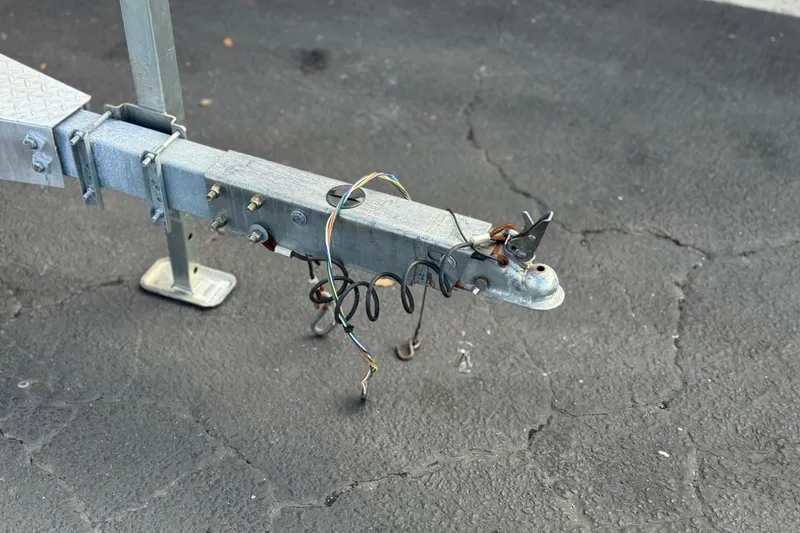 Slide: The Image of Trailer hitch of a 2020 Godfrey Monacco 255 SD on asphalt surface. - 36
