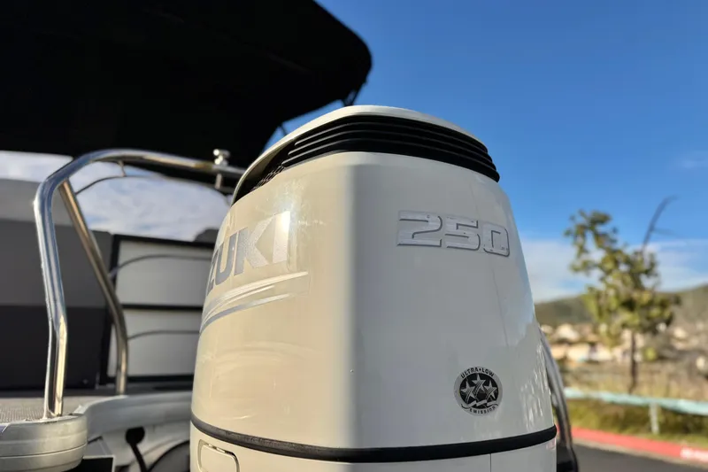 Slide: The Image of 2020 Godfrey Monacco 255 SD with Suzuki 250 outboard motor, sunny day background. - 8