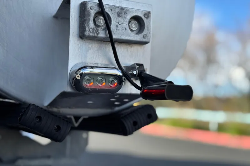 Slide: The Image of Close-up of a 2020 Godfrey Monacco 255 SD boat's rear light and wiring. - 9