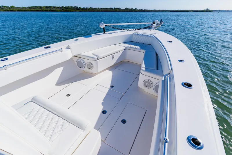 Slide: The Image of 2025 Contender 32 ST boat with spacious seating on calm water. - 10