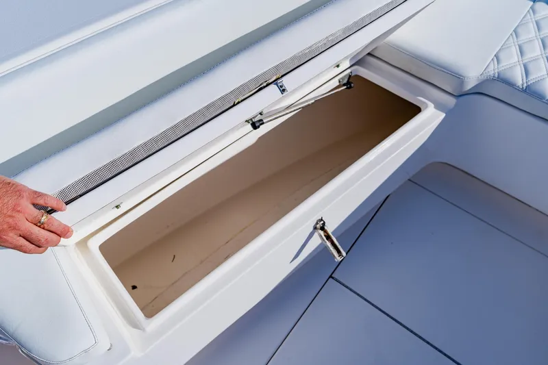 Slide: The Image of Open storage compartment on 2025 Contender 32 ST boat, showcasing interior space. - 14