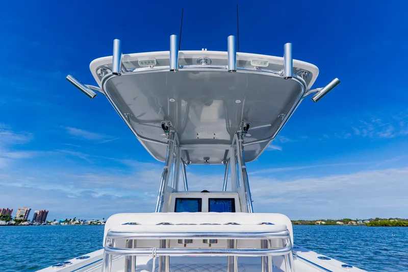 Slide: The Image of 2025 Contender 32 ST boat on water, featuring sleek design and advanced technology. - 28