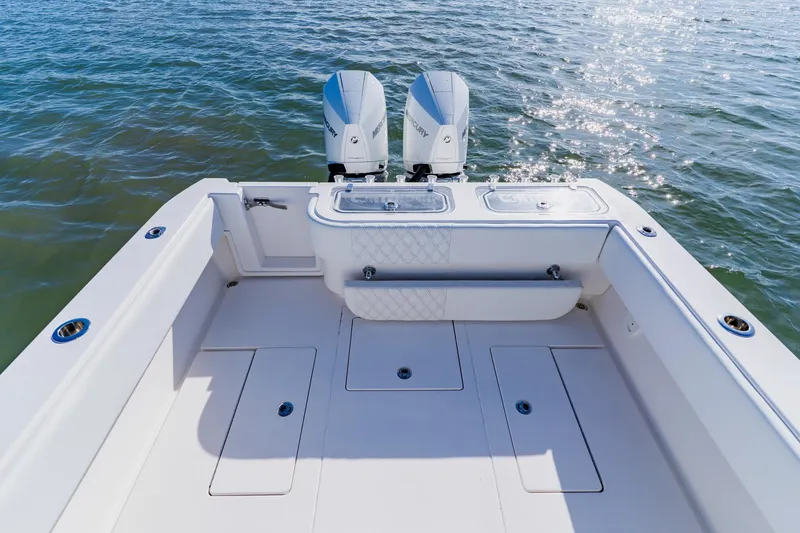 Slide: The Image of 2025 Contender 32 ST boat deck with dual engines on open water. - 30