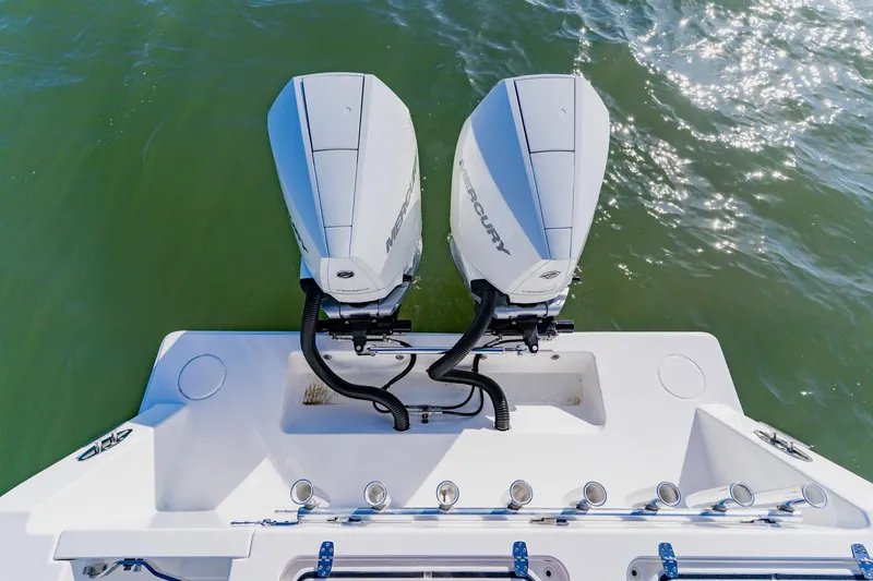 Slide: The Image of Twin Mercury outboard engines on 2025 Contender 32 ST boat, viewed from above. - 34