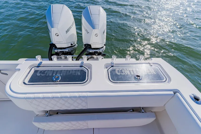 Slide: The Image of 2025 Contender 32 ST boat with dual Mercury engines on the water. - 35
