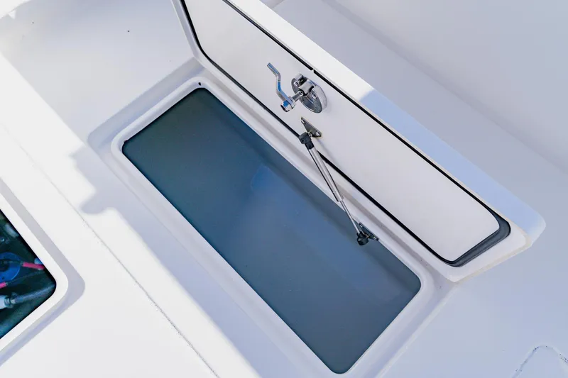 Slide: The Image of Open storage compartment on 2025 Contender 32 ST boat. - 42
