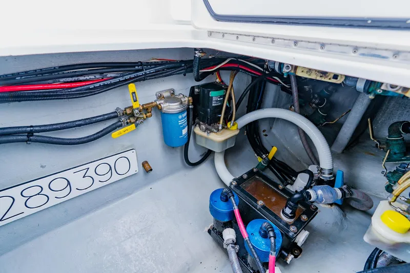 Slide: The Image of Engine compartment of 2025 Contender 32 ST boat, showcasing wiring and components. - 50