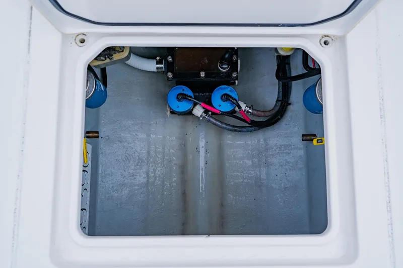 Slide: The Image of Contender 32 ST 2025 boat compartment with wiring and components. - 51
