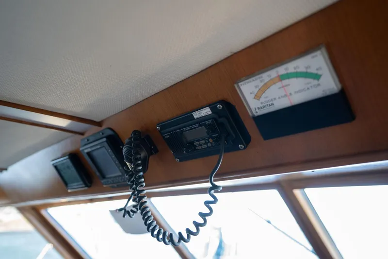 Slide: The Image of 1991 Lien Hwa Cockpit Sundeck interior with communication equipment and rudder angle indicator. - 14