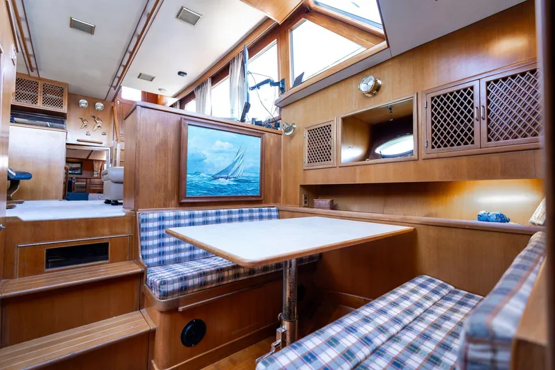 Slide: The Image of 1991 Lien Hwa Cockpit Sundeck interior with wood finish and plaid seating. - 19