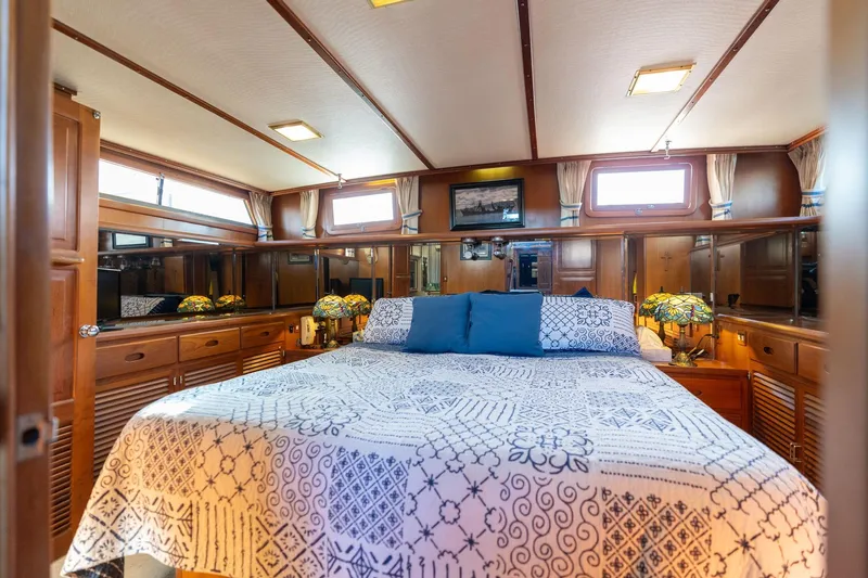 Slide: The Image of Luxurious 1991 Lien Hwa Cockpit Sundeck yacht bedroom with elegant wood finish and cozy bedding. - 25