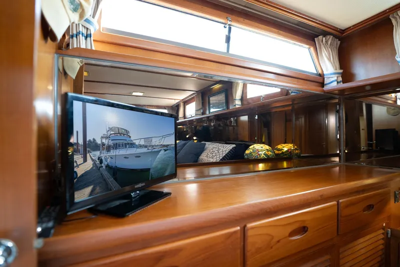 Slide: The Image of 1991 Lien Hwa Cockpit Sundeck interior with TV and wooden cabinetry. - 27