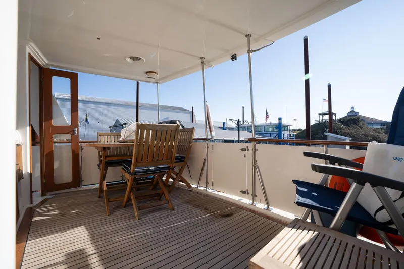 Slide: The Image of 1991 Lien Hwa Cockpit Sundeck with wooden deck and outdoor seating area. - 36