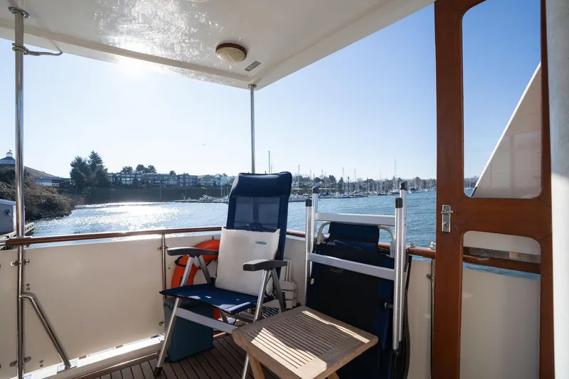 Slide: The Image of 1991 Lien Hwa Cockpit Sundeck with chairs, table, and scenic waterfront view. - 37