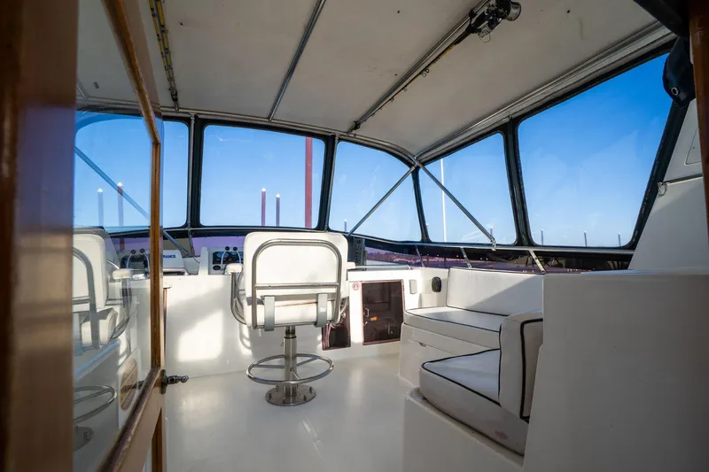 Slide: The Image of 1991 Lien Hwa Cockpit Sundeck interior with helm and seating, featuring panoramic windows. - 38