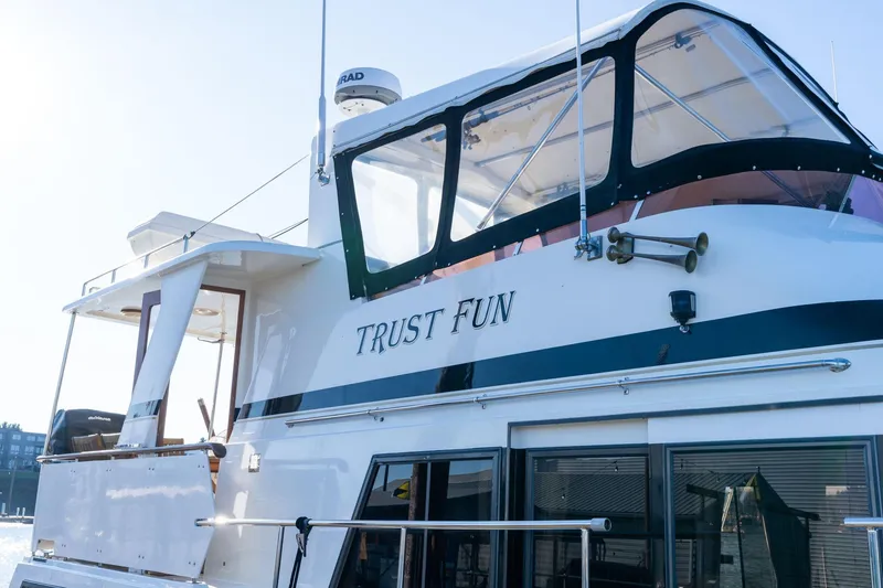 Slide: The Image of 1991 Lien Hwa Cockpit Sundeck yacht named "Trust Fun" docked in sunlight. - 4