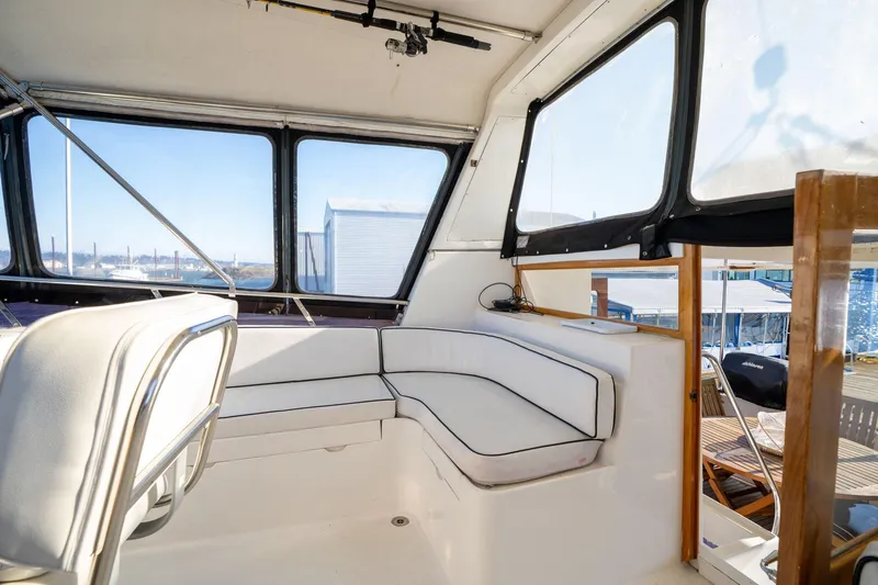 Slide: The Image of 1991 Lien Hwa Cockpit Sundeck interior with white seating and panoramic windows. - 43