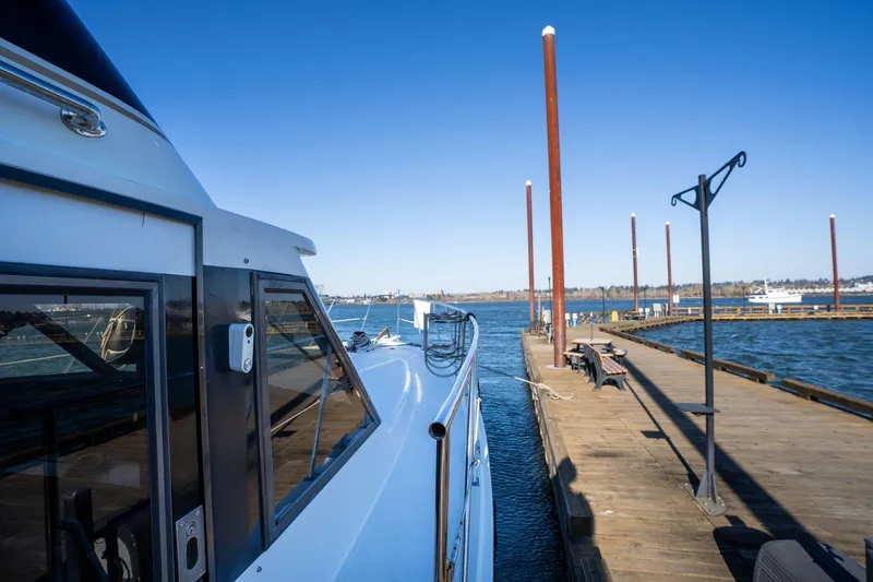 Slide: The Image of 1991 Lien Hwa Cockpit Sundeck yacht docked at a wooden pier under clear blue skies. - 45