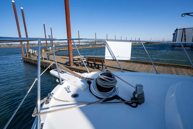 Slide: The Image of 1991 Lien Hwa Cockpit Sundeck yacht docked at a scenic marina. - 47