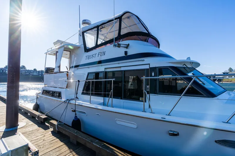 Slide: The Image of 1991 Lien Hwa Cockpit Sundeck yacht docked under bright sun. - 5