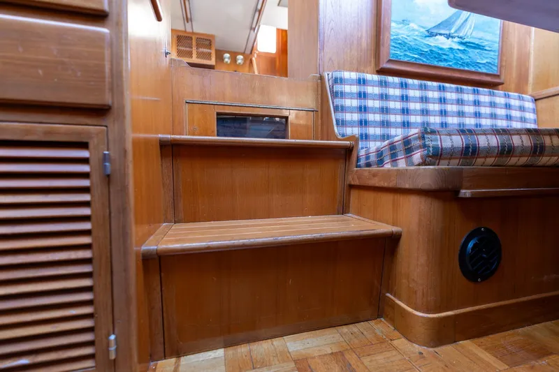 Slide: The Image of 1991 Lien Hwa Cockpit Sundeck interior with wooden steps and plaid seating. - 52