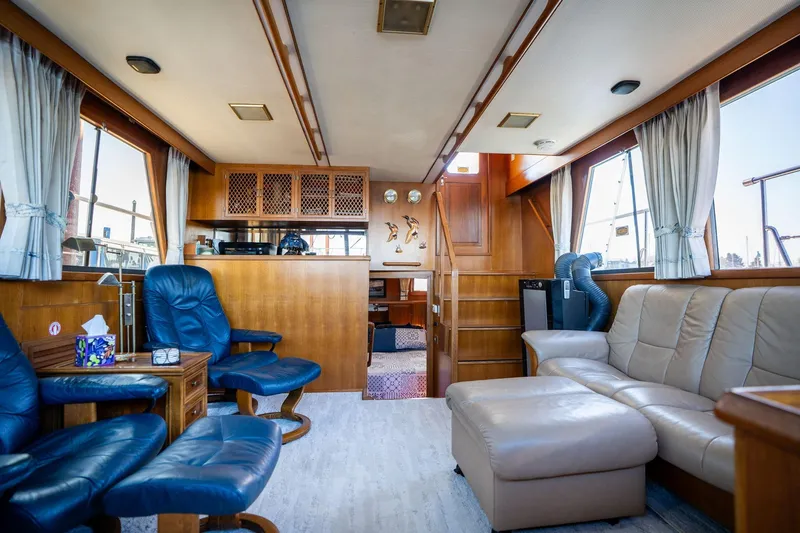 Slide: The Image of Luxurious interior of 1991 Lien Hwa Cockpit Sundeck yacht with leather seating and wood accents. - 6