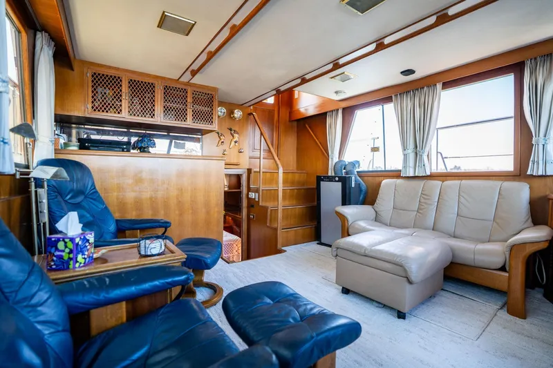 Slide: The Image of Luxurious interior of 1991 Lien Hwa Cockpit Sundeck yacht with leather seating and wooden accents. - 7