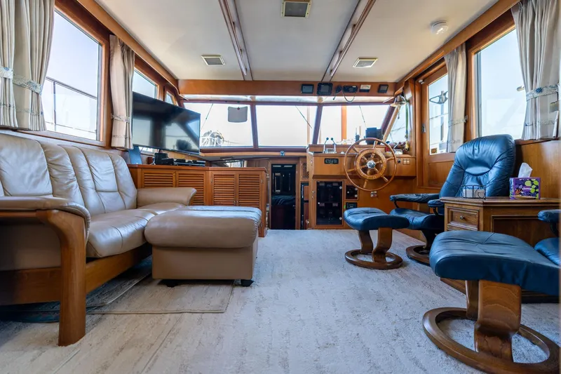 Slide: The Image of Luxurious 1991 Lien Hwa Cockpit Sundeck interior with leather seating and wooden helm. - 8
