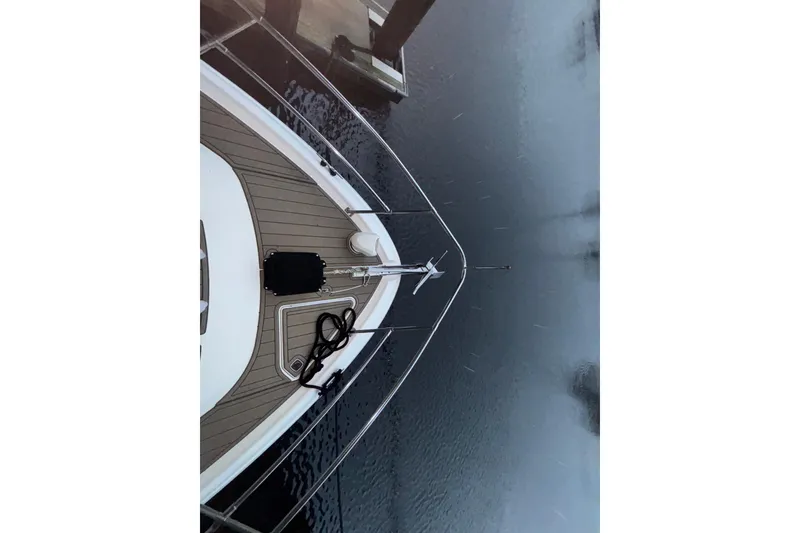 Slide: The Image of Aerial view of 1995 Sea Ray Sundancer 370 bow on calm water. - 12