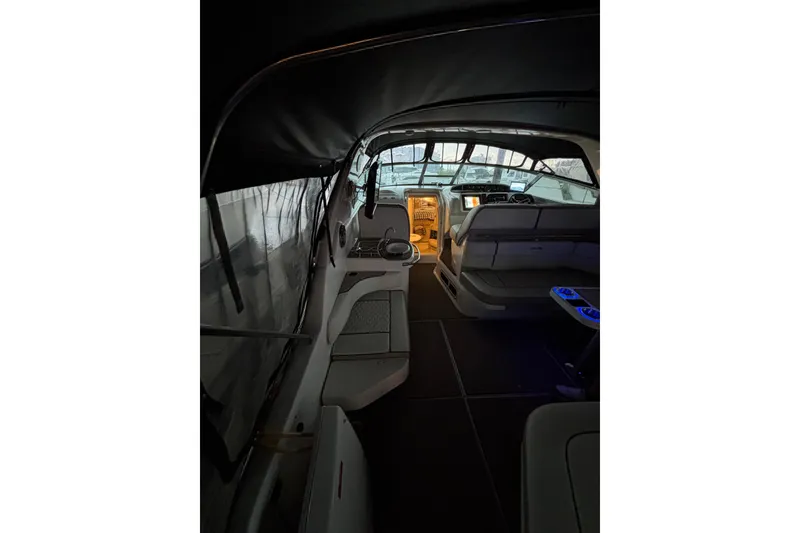 Slide: The Image of Interior of a 1995 Sea Ray Sundancer 370 boat with seating and helm. - 14