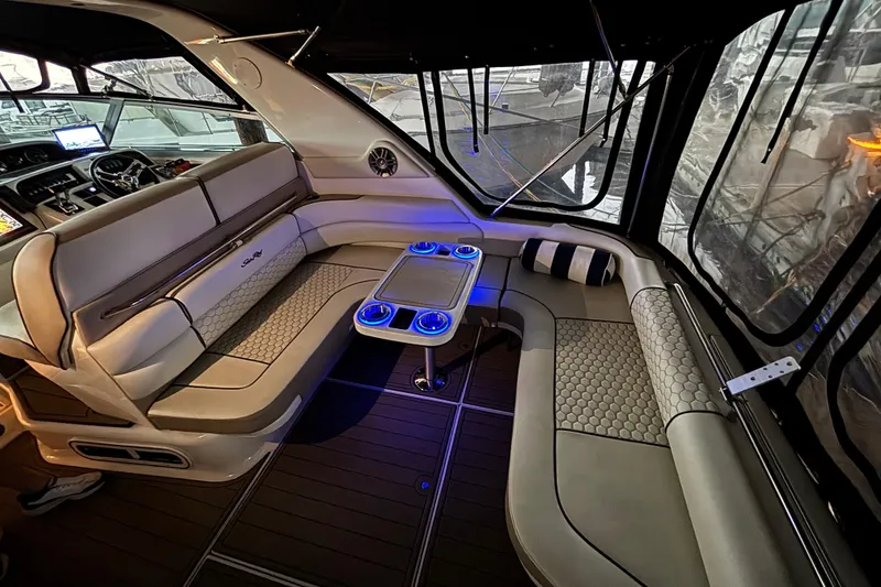 Slide: The Image of Luxurious interior of a 1995 Sea Ray Sundancer 370 with elegant seating and ambient lighting. - 15