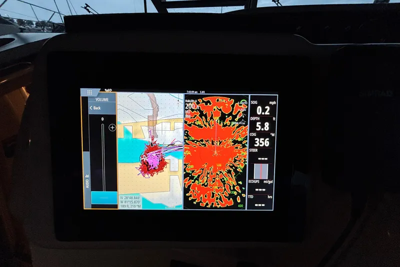 Slide: The Image of Navigation display on 1995 Sea Ray Sundancer 370, showing maps and radar data. - 19