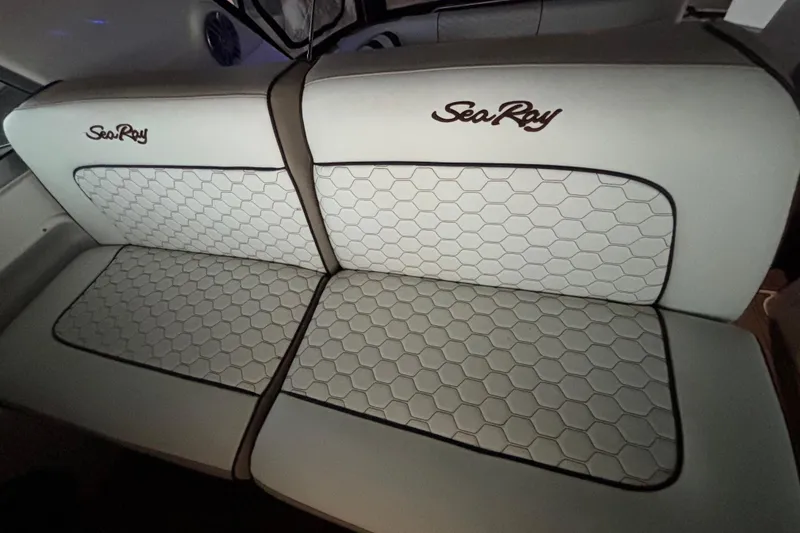 Slide: The Image of 1995 Sea Ray Sundancer 370 boat seating with hexagonal pattern and embroidered logo. - 21