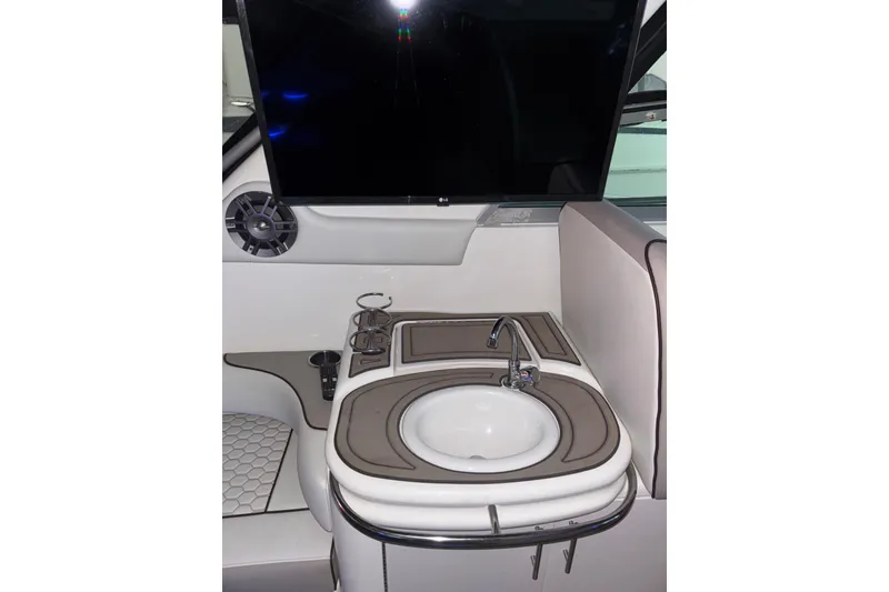 Slide: The Image of Interior of 1995 Sea Ray Sundancer 370 with sink and seating area. - 22