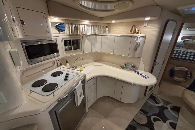 Slide: The Image of Luxurious 1995 Sea Ray Sundancer 370 yacht interior kitchen with modern amenities. - 23