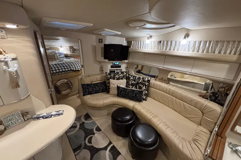 Slide: The Image of Interior of 1995 Sea Ray Sundancer 370 yacht with cozy seating and nautical decor. - 25