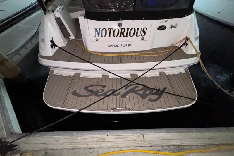 Slide: The Image of 1995 Sea Ray Sundancer 370 boat docked, named "Notorious," in Sanford, Florida. - 5
