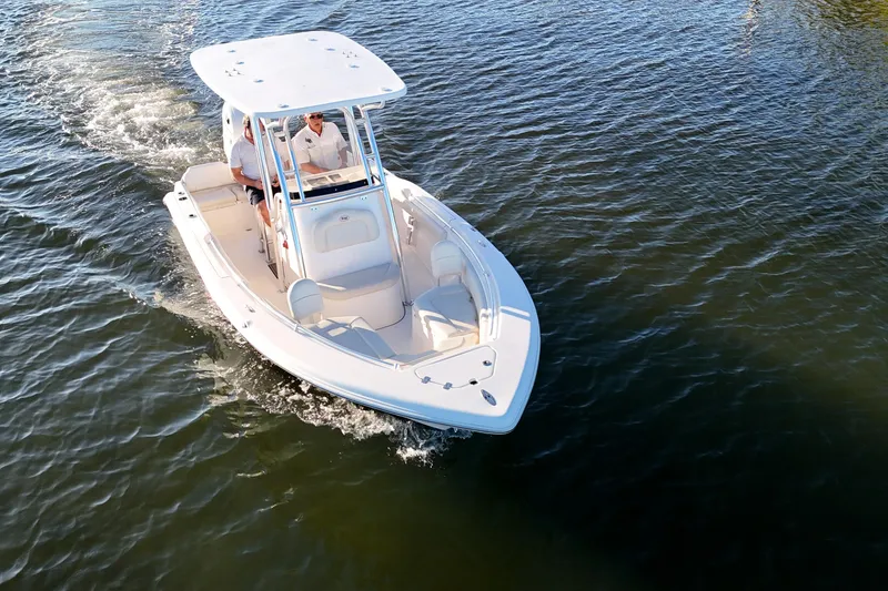 Slide: The Image of 2020 Key West 219 FS boat cruising on calm water, aerial view. - 1