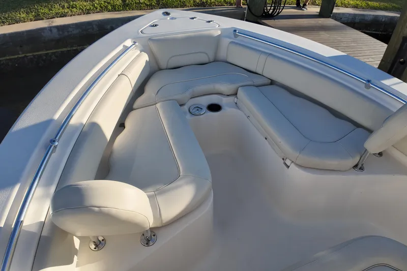 Slide: The Image of 2020 Key West 219 FS boat interior with cushioned seating and stainless steel rails. - 16