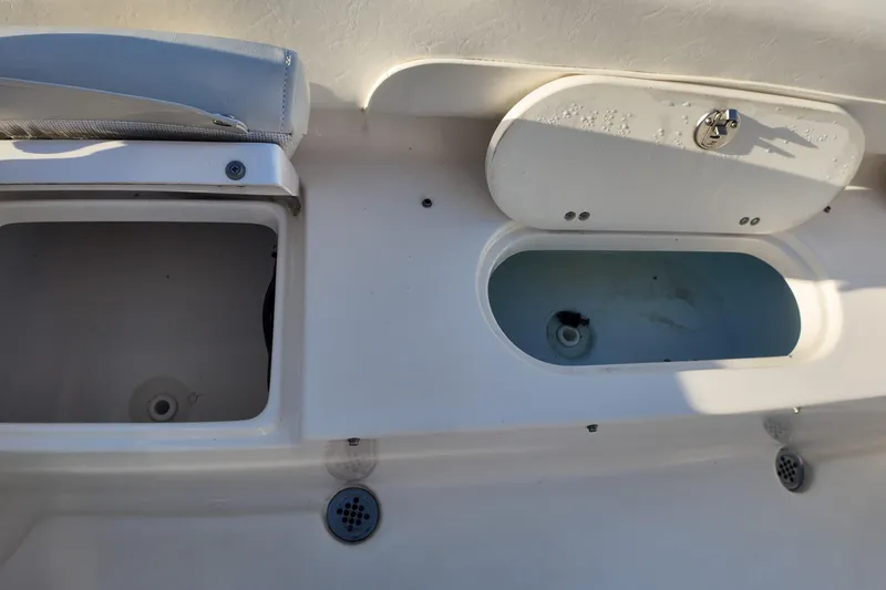 Slide: The Image of 2020 Key West 219 FS boat storage compartments and livewell. - 19