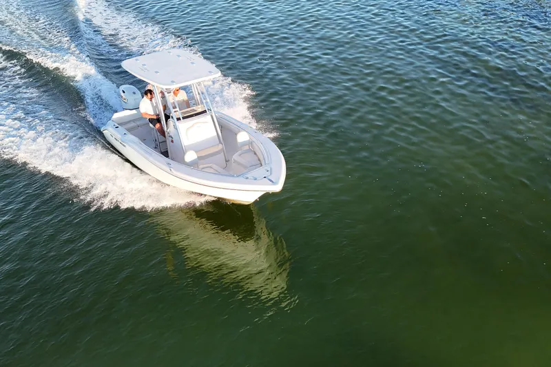 Slide: The Image of 2020 Key West 219 FS boat cruising on open water, aerial view. - 3