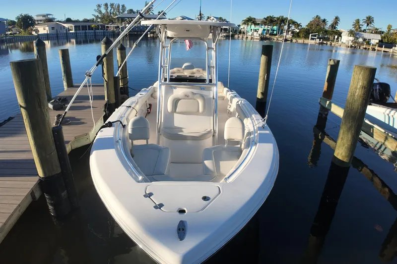 Slide: The Image of 2020 Key West 219 FS boat docked in a serene marina setting. - 5