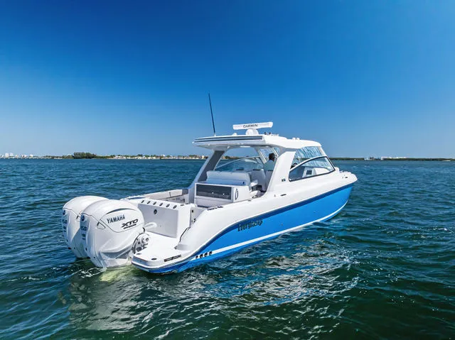 Slide: The Image of 2026 Everglades 367 CX boat docked with dual engines. - 14