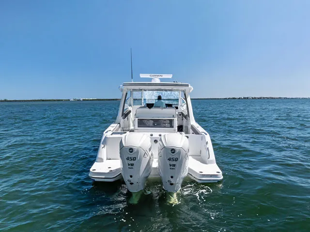 Slide: The Image of Everglades 367 CX 2026 boat docked with dual engines. - 15