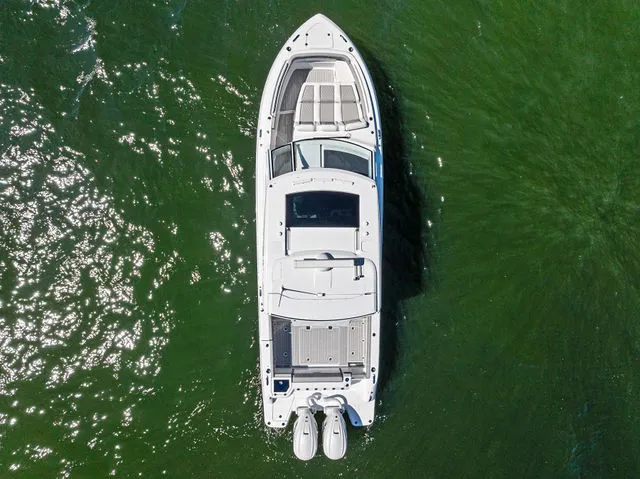 Slide: The Image of Everglades 367 CX 2026 with open storage compartment and Mercury 400 engine. - 22