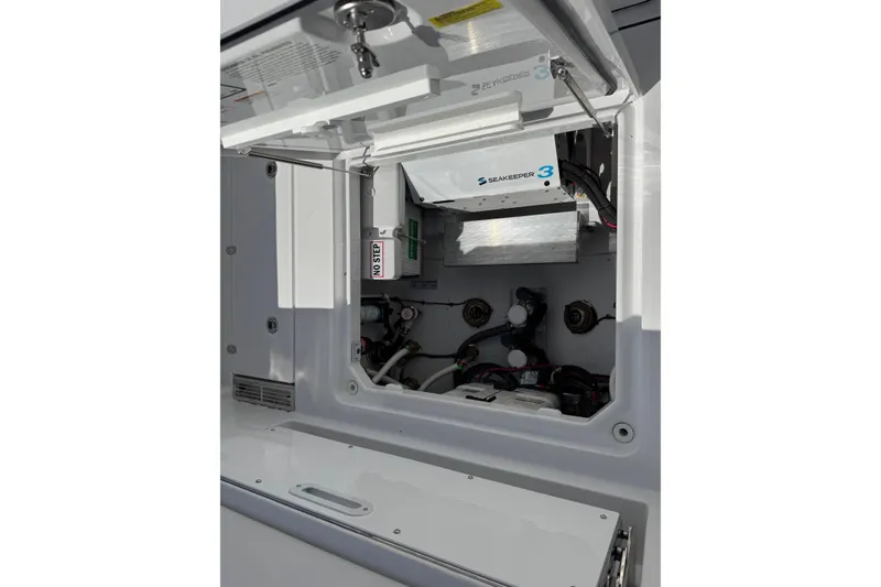 Slide: The Image of Interior view of 2026 Everglades 367 CX boat engine. - 39