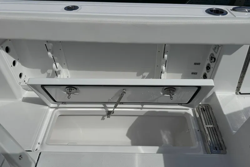 Slide: The Image of Everglades 367 CX 2026 boat storage compartment with open hatch. - 42