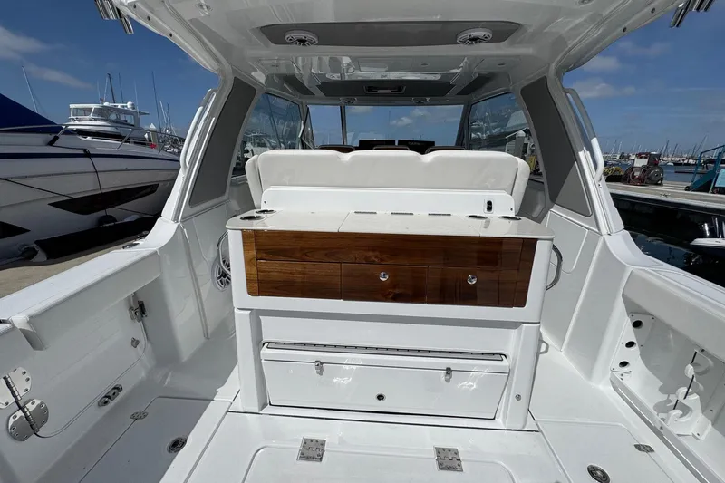 Slide: The Image of Interior of Everglades 367 CX yacht, 2026 model, docked at marina. - 44