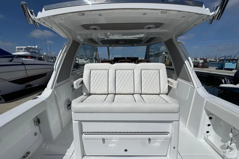Slide: The Image of Interior of Everglades 367 CX yacht, 2026 model, featuring luxurious seating. - 49
